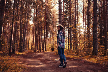 Fototapeta premium beautiful girl traveling in the woods