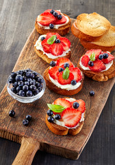 toasted bread with berries and cream cheese
