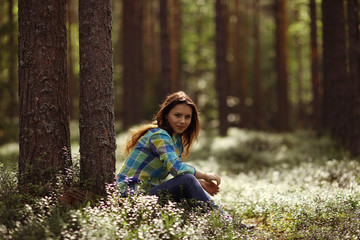 Young girl in the forest ranger