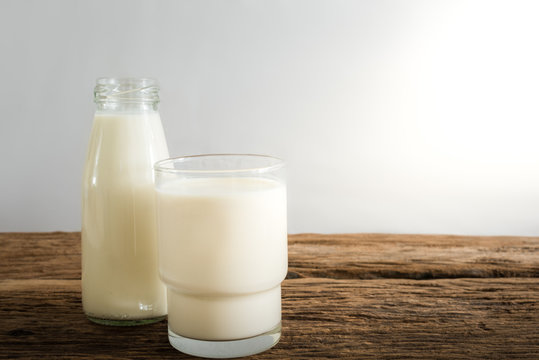 fresh milk in glass bottle and glass