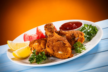 Roast chicken drumsticks and vegetables 