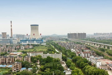 Fototapeta premium Power plants in residential areas aerial view