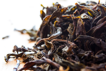Dry twisted chinese green tea leaves Shui Xiang macro
