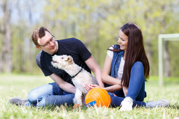 Happy young couple and  dog