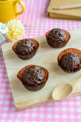 Chocolate balls on wooden plate and spoon