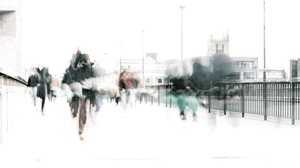Bleached commuters. High key, abstract captures of business commuters during early morning London rush hour.  Long exposure creating a motion blur to emulate the movement of the scene.