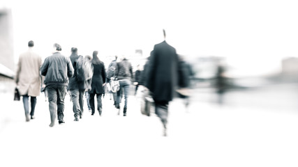 Bleached commuters. High key, abstract captures of business commuters during early morning London rush hour.  Long exposure creating a motion blur to emulate the movement of the scene.