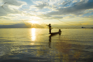 Fishermen in lake