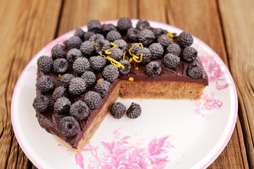 Delicious homemade chocolate pie with fresh blackberries, icing