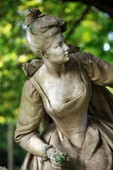 Fototapeta na wymiar Paris - A sculpture of beautiful woman in Luxembourg Garden