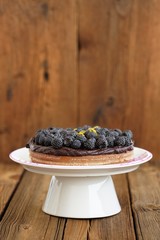 Tasty homemade chocolate pie with ganache, decorated with many f