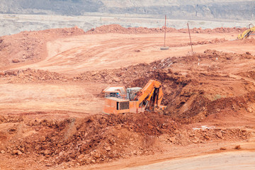 Part of a pit with big mining truck working