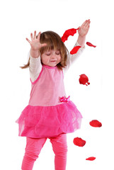 Cute little girl in a pink dress