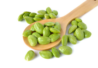 Parkia speciosa seeds or bitter bean on wooden spoon