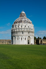 green lawn in front of Pisa baptistery  , Tuscany,  Italy