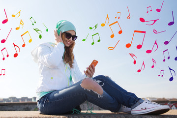 happy young woman with smartphone and headphones