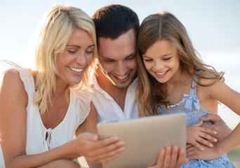 happy family with tablet pc taking picture