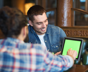 male friends with tablet pc at bar