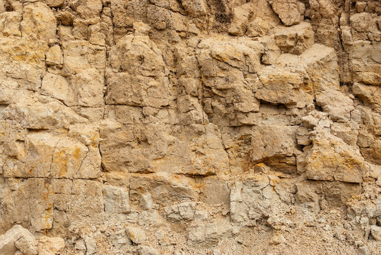 Wall of sand in sand pit close-up