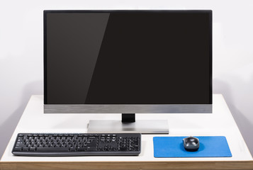 desktop computer with screen glare isolated on white