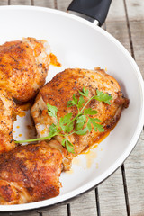Roasted chicken on a pan.