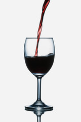 Red wine being poured into a glass