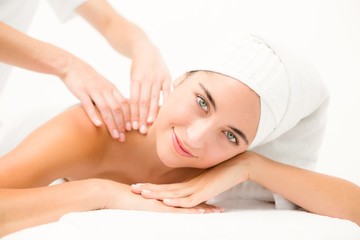 Attractive young woman receiving shoulder massage