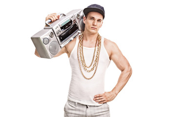 Young male rapper holding a ghetto blaster