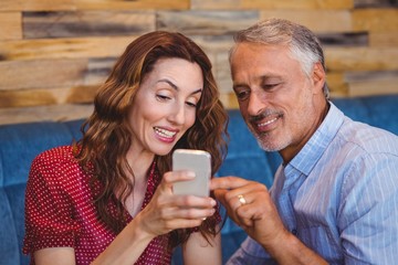 cute couple looking at their phones