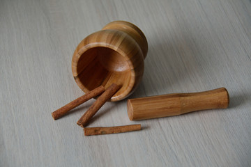 cinnamon, pestle and a mortar