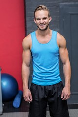 Fototapeta na wymiar Muscular man smiling at camera