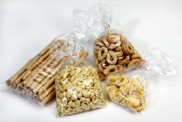 breadsticks, biscuits and pasta in cellophane bags