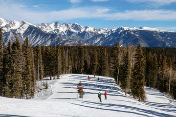 Skiers going down a ski run at Purgatory in Durango, Colorado