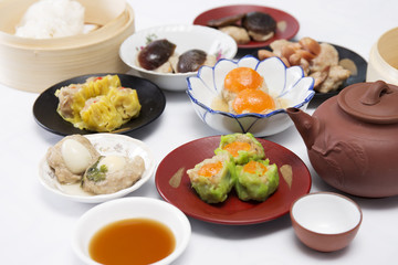 Fototapeta na wymiar Group of stream Dim Sum chinese food and hot Tea