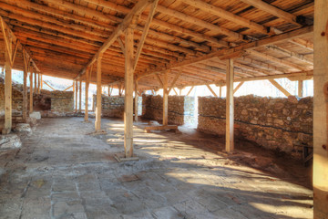 Ruins of an ancient fortress covered with wooden roof