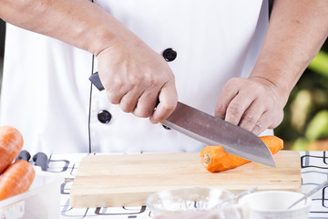 Chef is cutting carrots