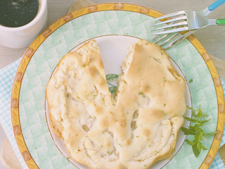 Charlotte apple pie garnished with lime zest and mint leaves