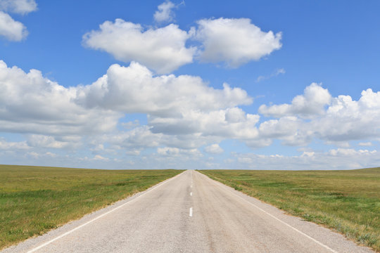 The Asphalt Road Straight Going Beyond The Horizon