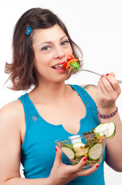 brunette girl eating salad