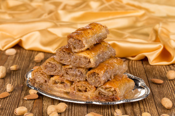 Traditional turkish baklava and peanuts.