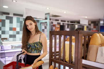 young woman shopping in supermarket