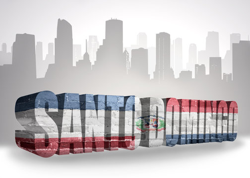 text santo domingo with national flag of dominican republic near abstract silhouette of the city