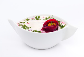 Cold soup with beets , carrots, yogurt and fresh herbs