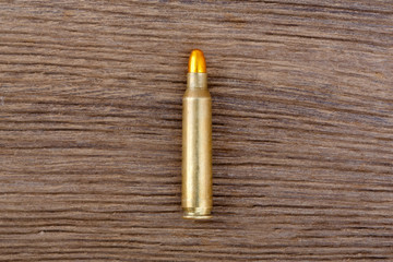 Old ammunition from second world war on the old wooden table.