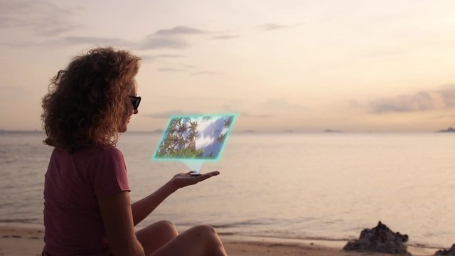 Woman Watching Video on Hologram Interface. Future Hi-Tech