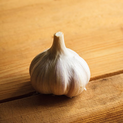 Raw Garlic On Wooden Background