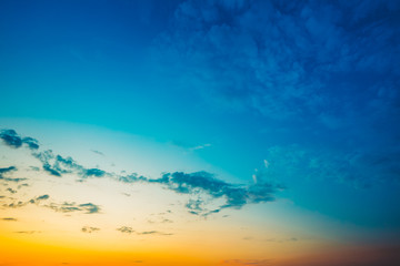 Fototapeta na wymiar Sky Background, Bright Blue, Orange And Yellow Colors Sunset