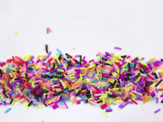 Fototapeta na wymiar lots of colorful confetti on white background