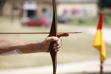 Arrow And Bow In Hands Of An Unidentified Archer