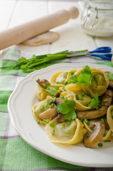 Homemade tortellini with mushrooms and herbs
